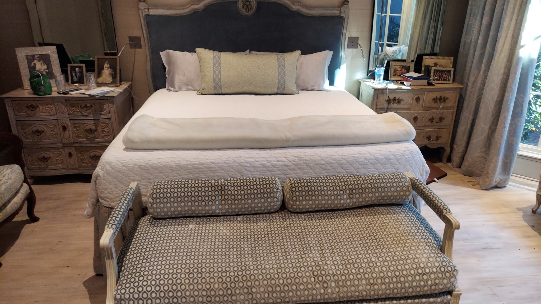 Master bedroom tidied with bed made and bench at the foot