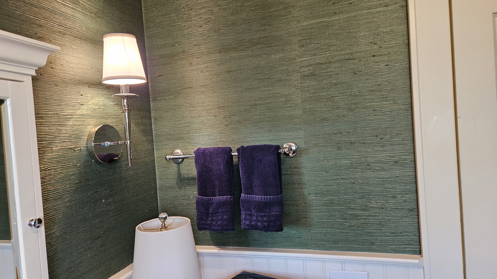 Powder room with towels folded and a clean sink